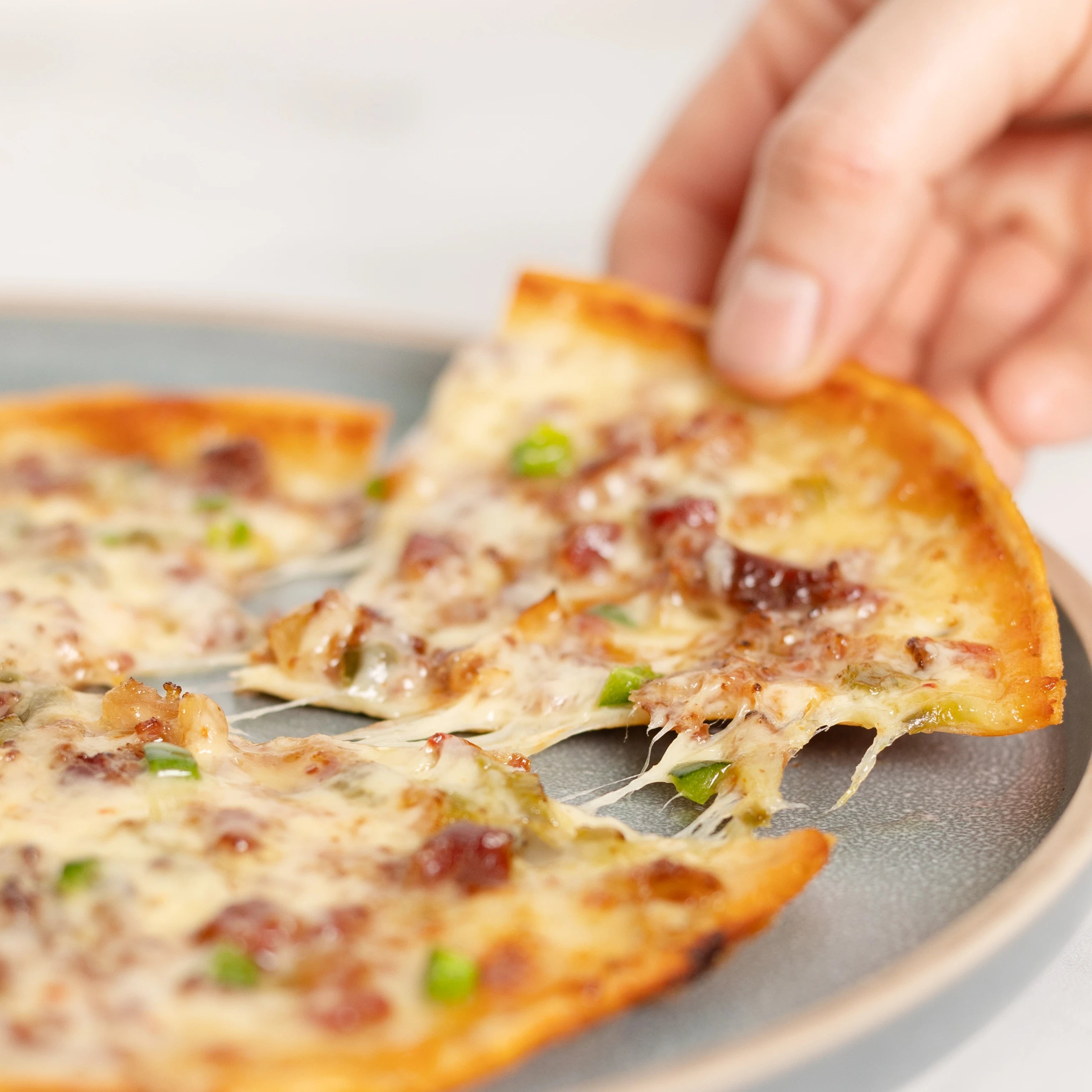 Slice of ZeroCarb LYFE jalapeno pizza close up